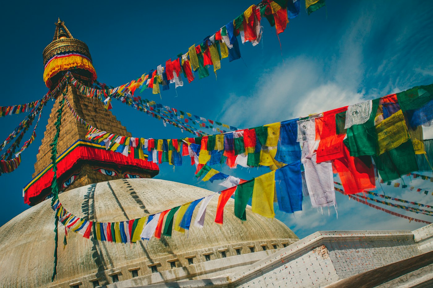 Prayer flags strung from the Boudhanath stupa in Kathmandu, Nepal